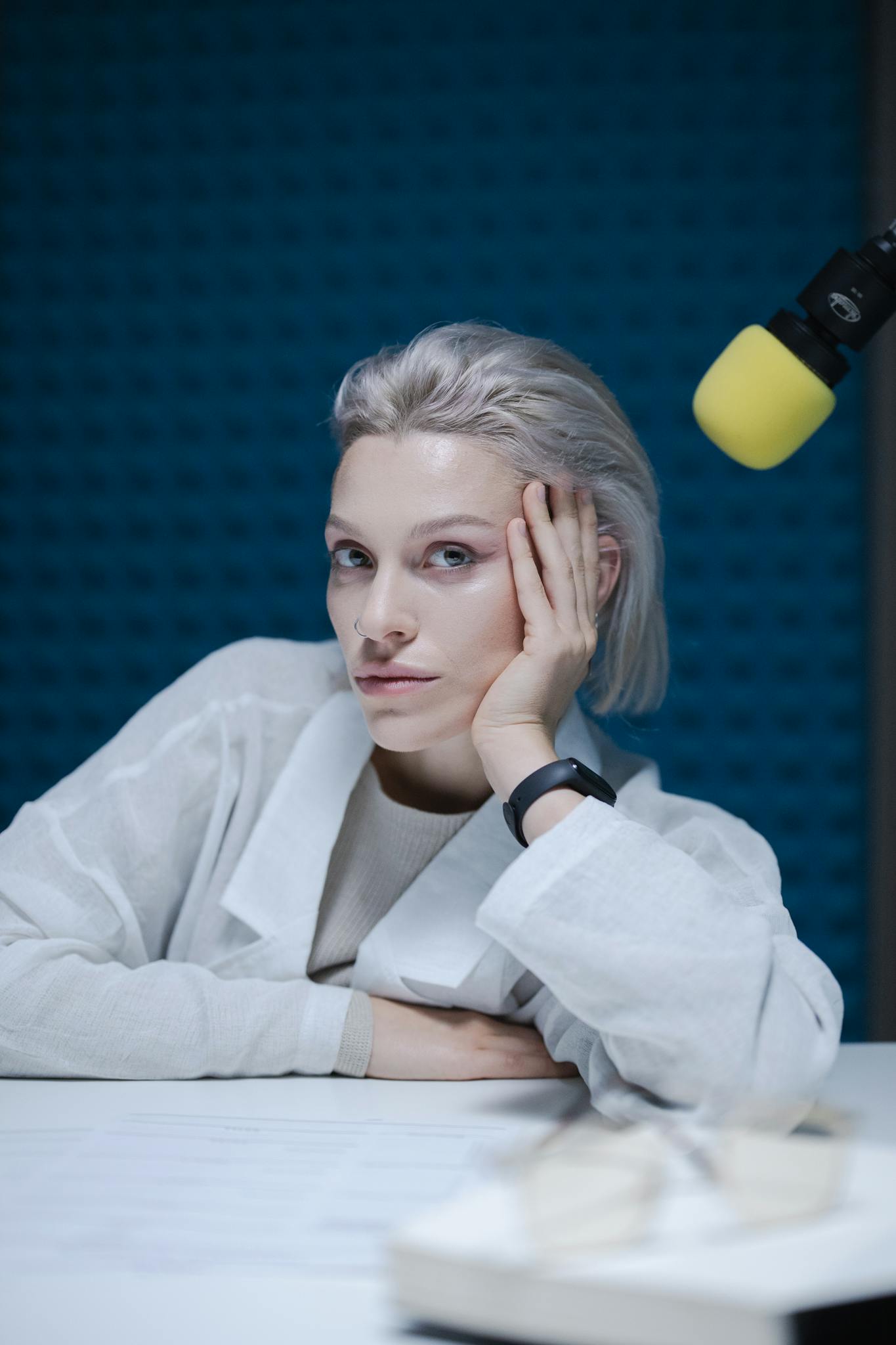 portrait of a woman recording a podcast